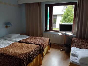 Фото номера Семейный номер (для 2 взрослых и 1 ребенка) Отель Lomakeskus Kuntoranta г. Варкаус 3
